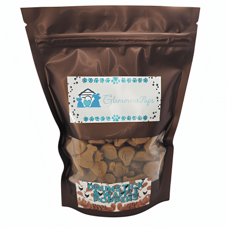 1lb resealable bag of Drumstick & Waffle Poppers Dog Treats by Glamorous Pups, displayed in a sleek, glossy brown package with a transparent window revealing the uniquely shaped treats inside. The label features the Glamorous Pups logo and blue paw prints, with the product name prominently showcased, highlighting the gourmet quality and creativity of these made-in-the-USA, nutritious dog treats.