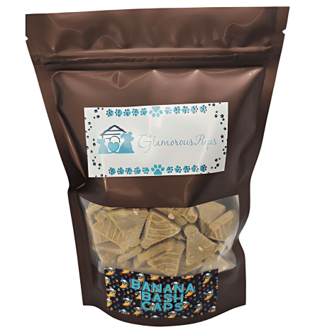 High-quality image of a 1lb bag of Banana Bash Caps Dog Treats by Glamorous Pups, featuring clearly visible branding and a window showing the treats inside. The packaging is decorated with vibrant colors and a festive banana-themed design, highlighting these unique and healthy treats designed for pampering dogs.