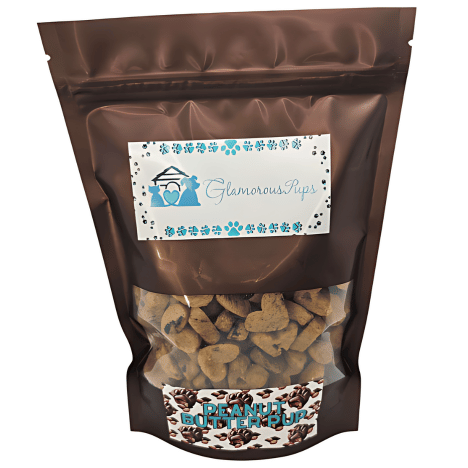 1lb bag of Peanut Butter Pup Dog Treats by Glamorous Pups, featuring a sleek brown resealable package with a transparent window showcasing premium, heart-shaped dog treats, highlighted by a distinctive blue and white branded label