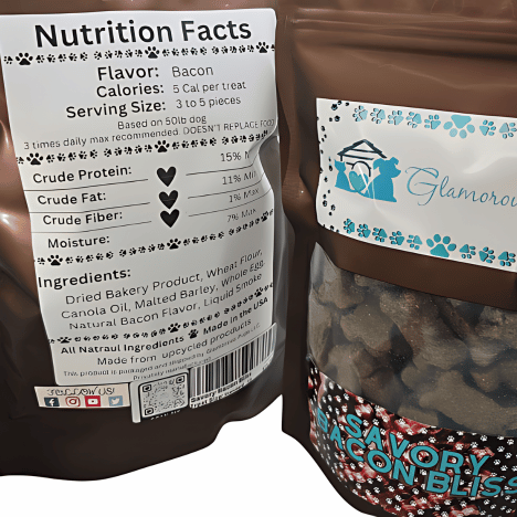 Close-up of a nutrition label on Savory Bacon Bliss Dog Treats by Glamorous Pups. The label details calories, serving size, and ingredients on a brown resealable bag, prominently displaying the Glamorous Pups logo and flavorful description.