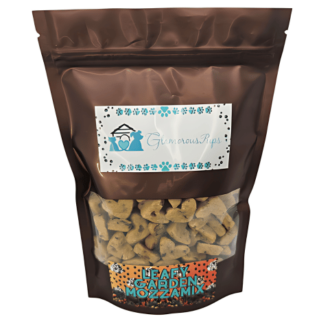 Packaged in an appealing brown bag, the Leafy Garden MozzaMix Dog Treats by Glamorous Pups feature a clear viewing window showcasing nutritious dog treats shaped like small bones. The label highlights a natural blend of spinach, kale, and mozzarella, tailored for pet owners seeking wholesome pet treat options.