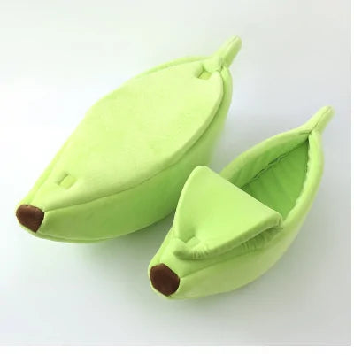 Banana Cat Bed in green from our vendor Zendrop, sold in our store Glamorous Pups. This playful and cozy cat bed features a unique banana peel design, providing a comfortable and fun hideaway for your feline friends. Perfect for adding a touch of whimsy to your pet's resting area.