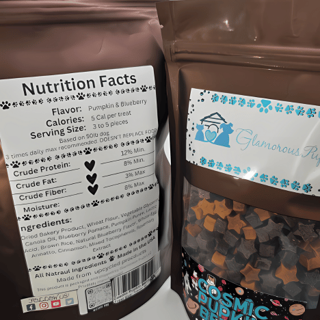 Nutrition facts label for Cosmic Pupkin Berry Dog Treats by Glamorous Pups, detailing a 5 calorie per treat content with pumpkin and blueberry flavors. This label highlights key nutritional benefits like high crude protein and fiber content, perfect for dog owners seeking healthy, gourmet snack options. Made in the USA from all-natural ingredients, these treats are an excellent choice for maintaining pet health and happiness.