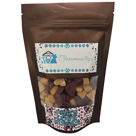 Compact 8oz bag of Pup's Love Kisses Dog Treats by Glamorous Pups, featuring a transparent section showcasing heart-shaped, multi-colored treats, encased in a chic, brown resealable package with a vibrant, love-themed label, ideal for pet owners who treat their dogs with high-quality, flavorful snacks.