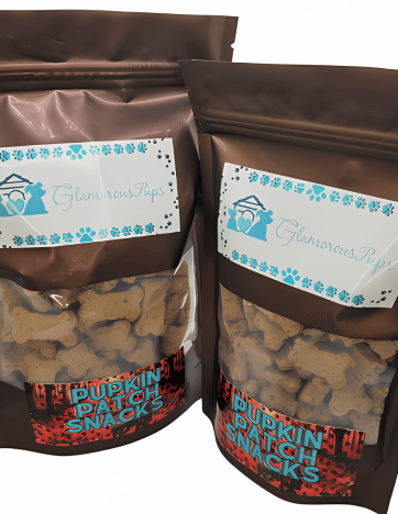 Two packages of Pupkin Patch Snacks Dog Treats by Glamorous Pups, showcasing brown resealable bags with a clear window displaying bone-shaped treats, highlighted with vibrant 'Pupkin Patch Snacks' labels and the distinctive Glamorous Pups logo.