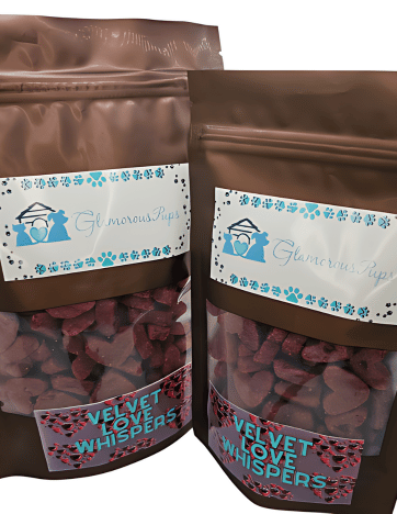 Elegant bags of Velvet Love Whispers Dog Treats by Glamorous Pups, presented in brown resealable packaging with a clear view of heart-shaped red treats, adorned with a stylish, romantic label design, perfect for treating your beloved canine to gourmet, love-themed snacks.