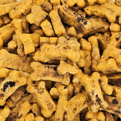 Close-up view of Choco-Chip Pup Crunchers Dog Treats by Glamorous Pups, showcasing their golden color and irregular shapes with visible carob chips. These treats are an excellent choice for pet owners searching for high-quality, tasty, and healthy dog snacks.