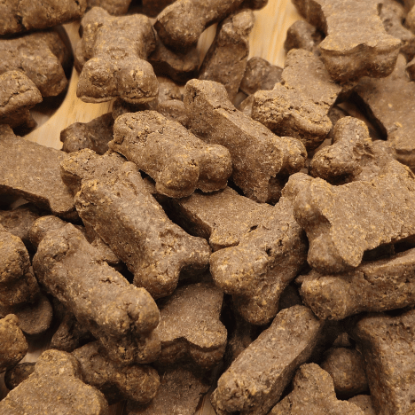 Macro view of Savory Bacon Bliss Dog Treats by Glamorous Pups, highlighting the rich, textured surface of bacon-flavored treats designed to entice and satisfy dogs, made by Glamorous Pups for quality pet nutrition.