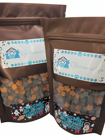 Displaying 1lb and 8oz bags of Cosmic Pupkin Berry Dog Treats by Glamorous Pups, these packages are adorned with vibrant, space-themed graphics and a transparent viewing section showing off the colorful, star and pumpkin-shaped treats. The Glamorous Pups logo prominently features, emphasizing these all-natural, USA-made treats as a top choice for pet owners looking for quality and flavor.