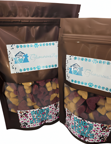 Display of Pup's Love Kisses Dog Treats by Glamorous Pups in two sizes, showcasing colorful heart-shaped treats in clear-view brown bags with a vibrant label design. Perfect for dog owners seeking delicious and visually appealing treats from Glamorous Pups.