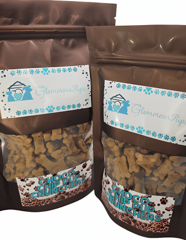 Brown and blue branded bags of Choco-Chip Pup Crunchers Dog Treats by Glamorous Pups. Each bag is filled with nutritious, visually appealing bone-shaped treats, perfect for dog owners seeking healthy, delicious options for their pets, displayed in clear windows for easy viewing.