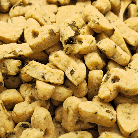  Zoomed-in view showcasing the unique texture of Leafy Garden MozzaMix Dog Treats by Glamorous Pups. These treats are shaped like small bones and packed with flavorful, natural ingredients like spinach, kale, and mozzarella. Ideal for those looking for organic, wholesome pet treats available from Glamorous Pups.