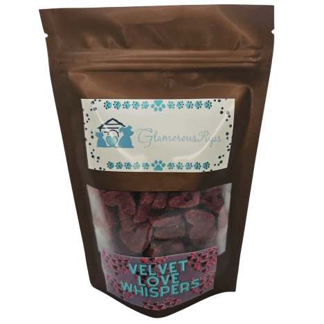 8oz bag of Velvet Love Whispers Dog Treats by Glamorous Pups, featuring a stylish brown resealable package with a transparent front showing heart-shaped red treats, branded with the elegant Glamorous Pups logo.