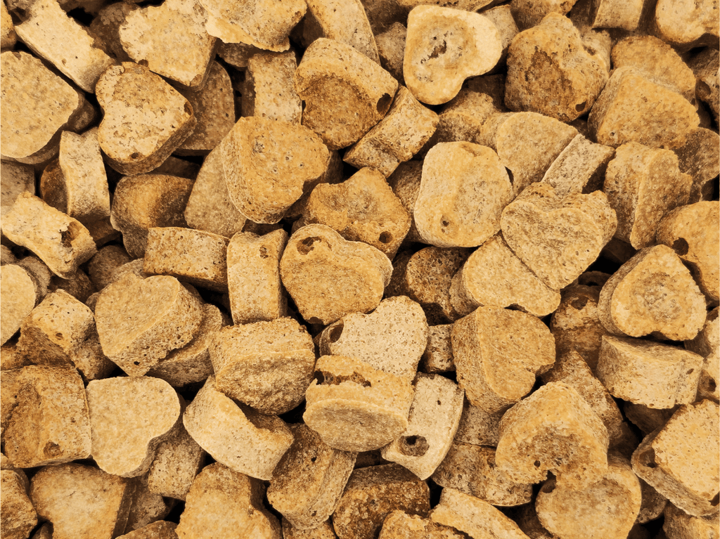 Zoomed-in image of Chick 'N' Nip Love Bites Cat Treats by Glamorous Pups, showcasing the unique texture and quality of these all-natural, nutritious cat treats designed to delight and satisfy feline tastes.