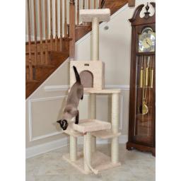 Siamese cat mid-leap on the Armarkat 69" Cat Tower Real Wood Cat Condo House, featuring an ivory plush finish and multiple sisal-wrapped scratching posts. The tower includes a cozy condo, lounging platforms, and a high perch, offering cats ample space for climbing, scratching, and playing. This durable cat tree is ideal for active and curious felines, providing both comfort and activity options.