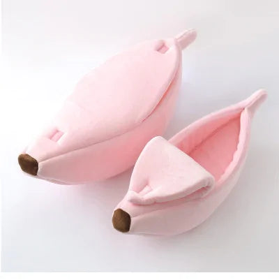 Banana Cat Bed from our vendor Zendrop, sold in our store Glamorous Pups. This pink, cozy cat bed offers a snug and fun hideaway for your feline friend, designed to resemble a banana peel for a playful and inviting sleeping area.