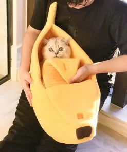 Comfy and whimsical Banana Cat Bed from our vendor Zendrop, available at Glamorous Pups. This unique cat bed features a peelable top, offering a cozy and secure hideaway for your feline friend. Perfect for enhancing your pet's lounging experience with a touch of playful charm.