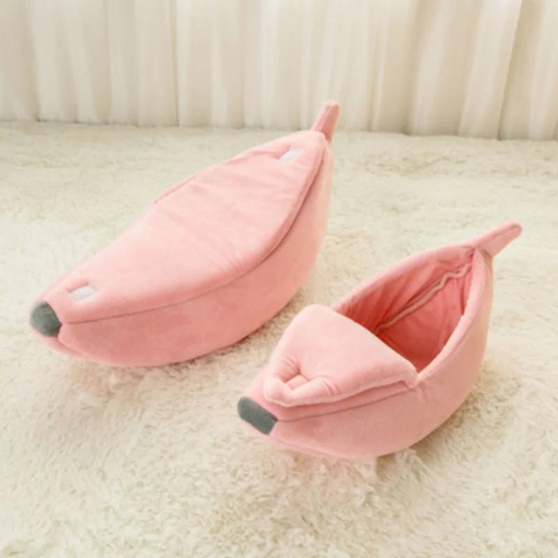 Adorable and cozy Banana Cat Bed in soft pink from our vendor Zendrop, available at Glamorous Pups. This unique cat bed features a peelable top, creating a snug and playful hideaway for your feline friend. Enhance your pet's lounging area with this whimsical and comfortable addition.